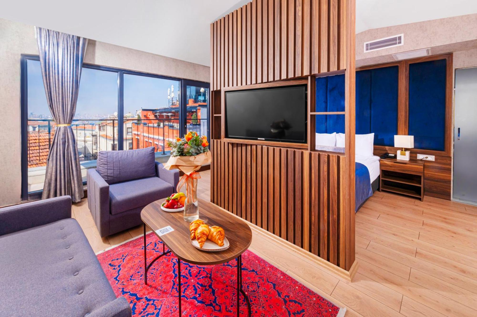 Suite mit Kingsize-Bett und Balkon