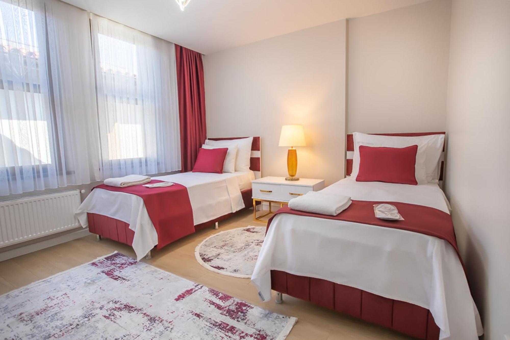 Aparthotel mit 1 Kingsize-Bett und 2 Einzelbetten