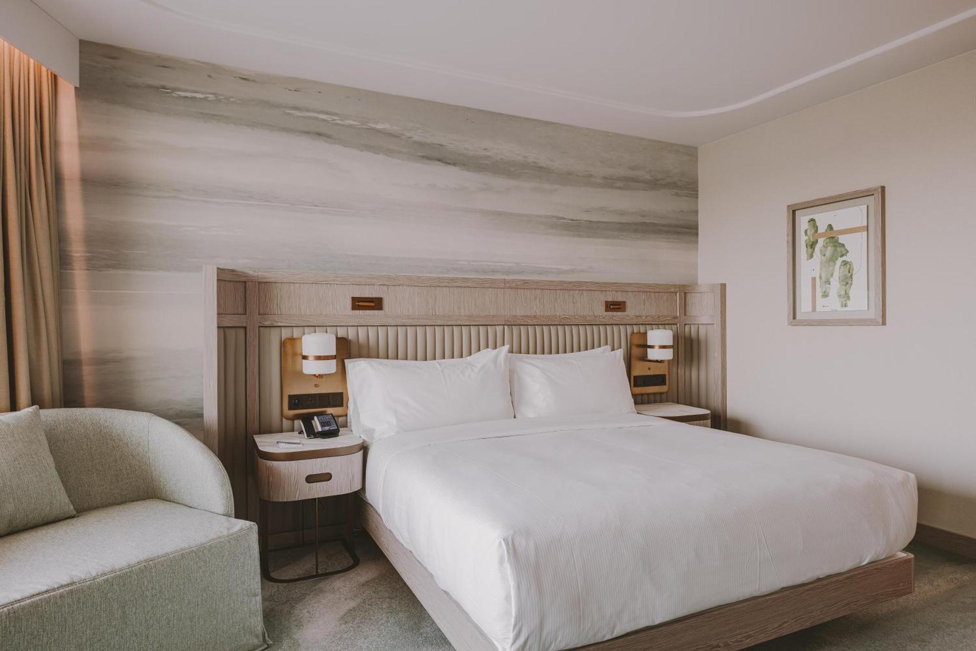 Deluxe Zimmer mit Kingsize-Bett mit Meerblick