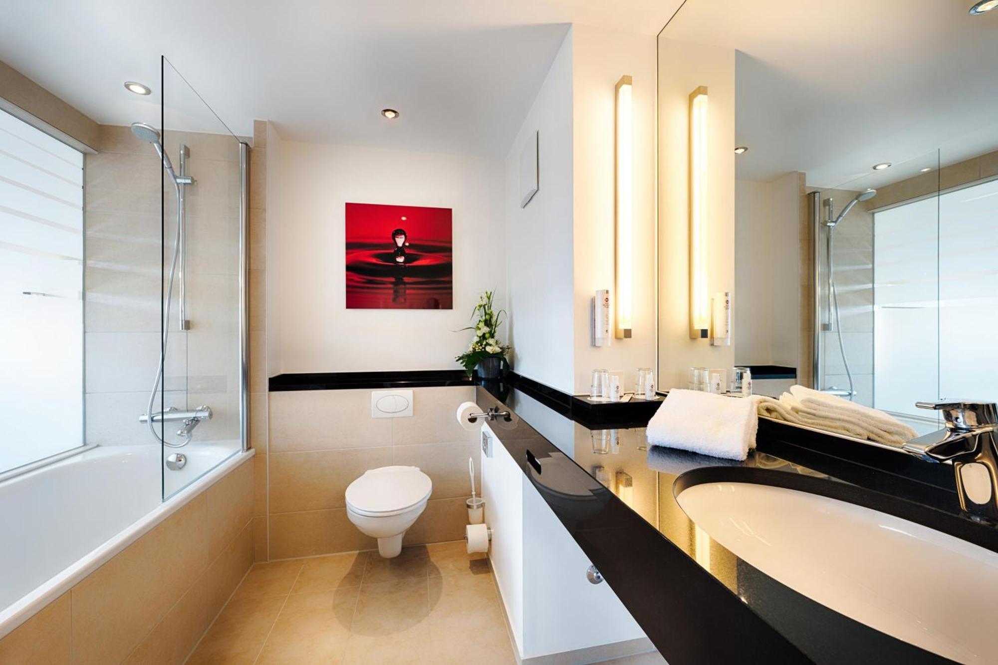 Junior Suite mit 2 Einzelbetten, Schlafsofa und Badewanne