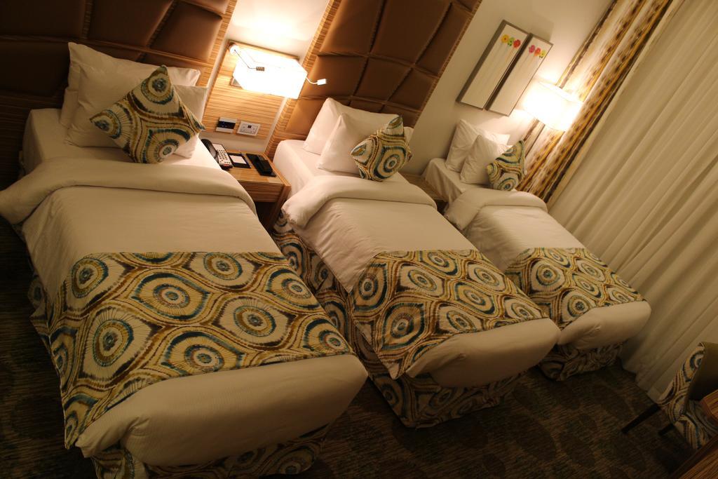 Deluxe Zimmer mit 3 Einzelbetten