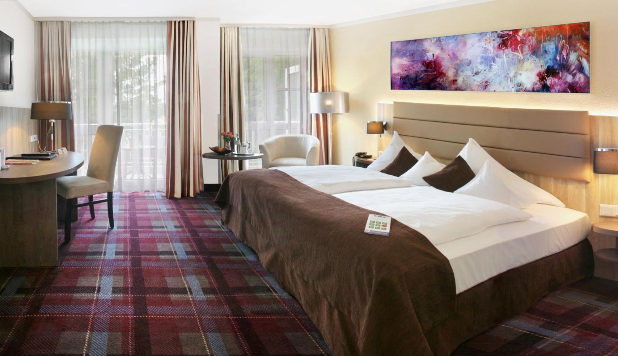 Superior Zimmer mit Kingsize-Bett und Balkon